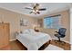 Bedroom with white comforter and ceiling fan offers a comfortable retreat at 10725 Wrigley Field Ave, Las Vegas, NV 89166