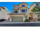 Charming two-story home features a tiled roof, two-car garage and well-maintained landscaping at 10725 Wrigley Field Ave, Las Vegas, NV 89166