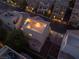 Aerial view showcasing the home's rooftop deck, tile roof, and landscaping at 10725 Wrigley Field Ave, Las Vegas, NV 89166