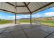 Shot of a gazebo with benches overlooking the green space with mountain views at 10725 Wrigley Field Ave, Las Vegas, NV 89166