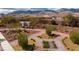 Aerial shot showcasing the community green space with brick pathways, landscaping, and architectural features at 10725 Wrigley Field Ave, Las Vegas, NV 89166