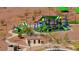 Overhead view of a brightly colored community playground with slides and climbing structures at 10725 Wrigley Field Ave, Las Vegas, NV 89166