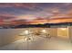 Outdoor rooftop patio with seating, lighting, views of mountains and sunset at 10725 Wrigley Field Ave, Las Vegas, NV 89166