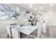 Bright kitchen and dining area with stainless steel appliances and modern gray cabinets at 10922 Cambridge Lakes Ave, Las Vegas, NV 89166