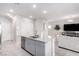 Kitchen featuring a large center island with sink, appliances and plenty of storage at 10922 Cambridge Lakes Ave, Las Vegas, NV 89166