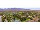 An aerial view shows homes in the community and golf course with ponds at 11 Belfair Ct, Henderson, NV 89052