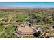 An aerial view of the golf course community with lush greenery and scenic views of the mountains and Las Vegas skyline at 11 Belfair Ct, Henderson, NV 89052