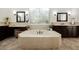 Large soaking tub centered between and sink vanities at 11 Belfair Ct, Henderson, NV 89052