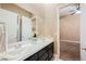 Bathroom featuring double sink marble vanity with storage at 11 Belfair Ct, Henderson, NV 89052