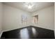 Empty bedroom with dark wood floors and a large window at 11 Belfair Ct, Henderson, NV 89052