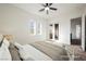 Virtually staged bedroom with neutral colors and carpeted floors at 11 Belfair Ct, Henderson, NV 89052