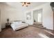 Bedroom with plush carpet, and a bed facing steps leading to another room at 11 Belfair Ct, Henderson, NV 89052