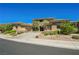 Beautiful two-story home with manicured landscaping and a circular driveway at 11 Belfair Ct, Henderson, NV 89052