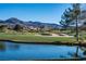 Beautiful golf course with water feature. A lush green golf course against a backdrop of scenic mountains provides an idyllic setting at 11 Belfair Ct, Henderson, NV 89052