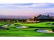 Picturesque view of the golf course and clubhouse overlooking the city at 11 Belfair Ct, Henderson, NV 89052