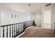 Hallway with curved railing and mountain views at 11 Belfair Ct, Henderson, NV 89052