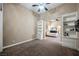 Living room featuring built-in shelving with open doorway to bedroom, bathed in neutral tones at 11 Belfair Ct, Henderson, NV 89052