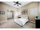 A spacious main bedroom featuring neutral tones, carpeted floors, and ceiling fan at 11 Belfair Ct, Henderson, NV 89052