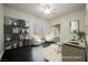 Staged home office featuring hardwood floors and two windows for natural light at 11 Belfair Ct, Henderson, NV 89052