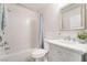 This bathroom features a shower-tub combo and a vanity with storage at 1105 Pawnee Ln, Henderson, NV 89015