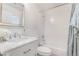 Clean bathroom with a shower-tub combo, marble vanity and white cabinets at 1105 Pawnee Ln, Henderson, NV 89015