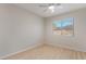 Inviting bedroom featuring wood-look floors, a ceiling fan and a window at 1105 Pawnee Ln, Henderson, NV 89015