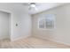 This bright bedroom features wood-look floors, a ceiling fan, and a window at 1105 Pawnee Ln, Henderson, NV 89015