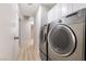 This laundry room includes a washer and dryer at 1105 Pawnee Ln, Henderson, NV 89015