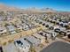 A community aerial view showcasing the layout of homes, landscaping, and surrounding mountains at 12525 Lylan Ridge St, Las Vegas, NV 89138