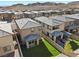 Aerial view of the home's backyard with artificial turf and small patio with views of neighboring homes at 12525 Lylan Ridge St, Las Vegas, NV 89138