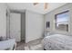 Cozy bedroom featuring wood floors, neutral walls, a ceiling fan and natural light at 12525 Lylan Ridge St, Las Vegas, NV 89138