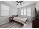 Bedroom featuring natural light and a neutral color scheme, complete with wood-look flooring at 12525 Lylan Ridge St, Las Vegas, NV 89138