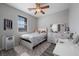 Bedroom features a ceiling fan, window, and desk, providing a comfortable living space at 12525 Lylan Ridge St, Las Vegas, NV 89138
