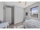 A bright bedroom with a large closet, a window, and light-colored walls and flooring at 12525 Lylan Ridge St, Las Vegas, NV 89138
