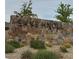 Community entrance sign with stone detailing and lush landscaping around the monument at 12525 Lylan Ridge St, Las Vegas, NV 89138