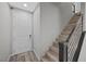 Bright entryway featuring wood stairs with modern railings, offering a welcoming entrance at 12525 Lylan Ridge St, Las Vegas, NV 89138