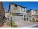 Charming two-story home with neutral colors, attached garage, and patterned brick driveway at 12525 Lylan Ridge St, Las Vegas, NV 89138