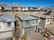 Two-story home featuring a two-car garage, desert landscaping, and mountain views at 12525 Lylan Ridge St, Las Vegas, NV 89138