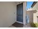 Stylish front entrance featuring a modern door, accent wall, and decorative fountain at 12525 Lylan Ridge St, Las Vegas, NV 89138