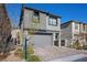 Charming two-story home with a paved driveway, a gray exterior, and well-manicured landscaping at 12525 Lylan Ridge St, Las Vegas, NV 89138