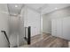 Hallway with wood-look floors leading to closets and bedrooms, offering plenty of storage at 12525 Lylan Ridge St, Las Vegas, NV 89138
