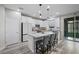 Modern kitchen boasts white cabinets, granite countertops, and a functional island at 12525 Lylan Ridge St, Las Vegas, NV 89138