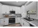 Well-equipped kitchen includes modern appliances, granite countertops, and ample cabinet space at 12525 Lylan Ridge St, Las Vegas, NV 89138