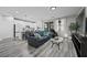 Bright, open-concept living room boasts hardwood floors and seamlessly connects to a modern kitchen at 12525 Lylan Ridge St, Las Vegas, NV 89138