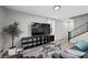 Cozy living area features stylish decor, a large television, and comfortable seating at 12525 Lylan Ridge St, Las Vegas, NV 89138