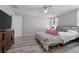 Bright main bedroom with wood floors, neutral walls, ceiling fan, and natural light at 12525 Lylan Ridge St, Las Vegas, NV 89138