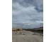 Unfinished construction site displaying a building under development and a pile of rocks at 12525 Lylan Ridge St, Las Vegas, NV 89138