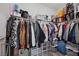 Organized walk-in closet featuring ample hanging space and built-in storage shelves for shoes, bags and more at 12525 Lylan Ridge St, Las Vegas, NV 89138