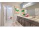 Bathroom featuring a double sink vanity and view of a white bathtub at 1918 Molly Brook Dr # Lot 5, North Las Vegas, NV 89084