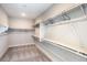 Walk-in closet featuring carpeted floor and built in shelving and clothes rods at 1918 Molly Brook Dr # Lot 5, North Las Vegas, NV 89084